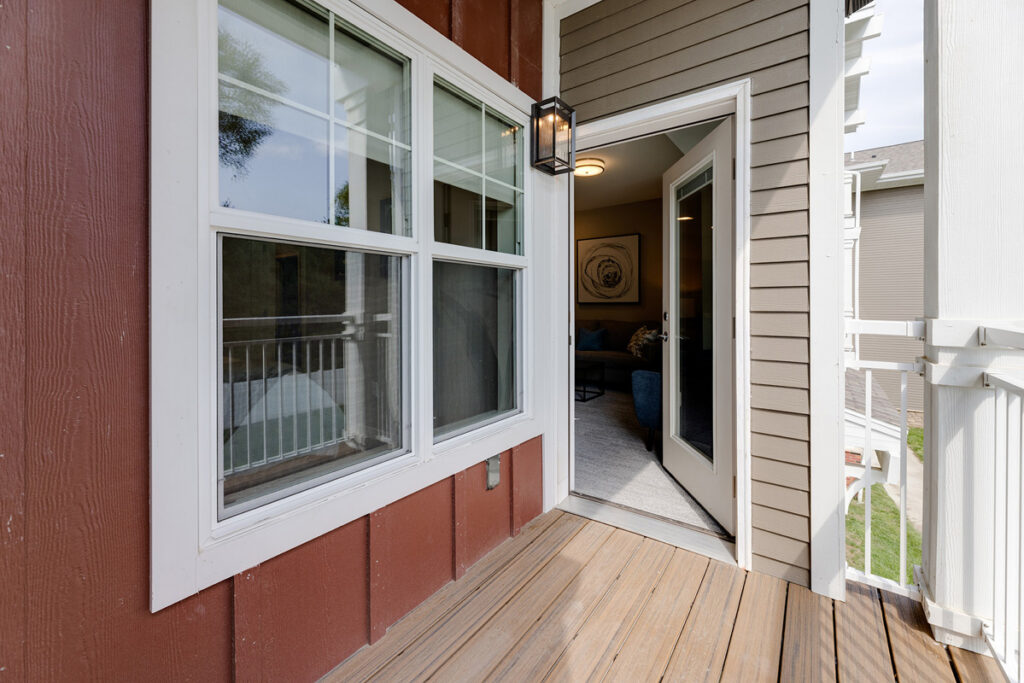 Private apartment balcony at Meadowview of Johnston featuring outdoor space and direct access from the resident living area.
